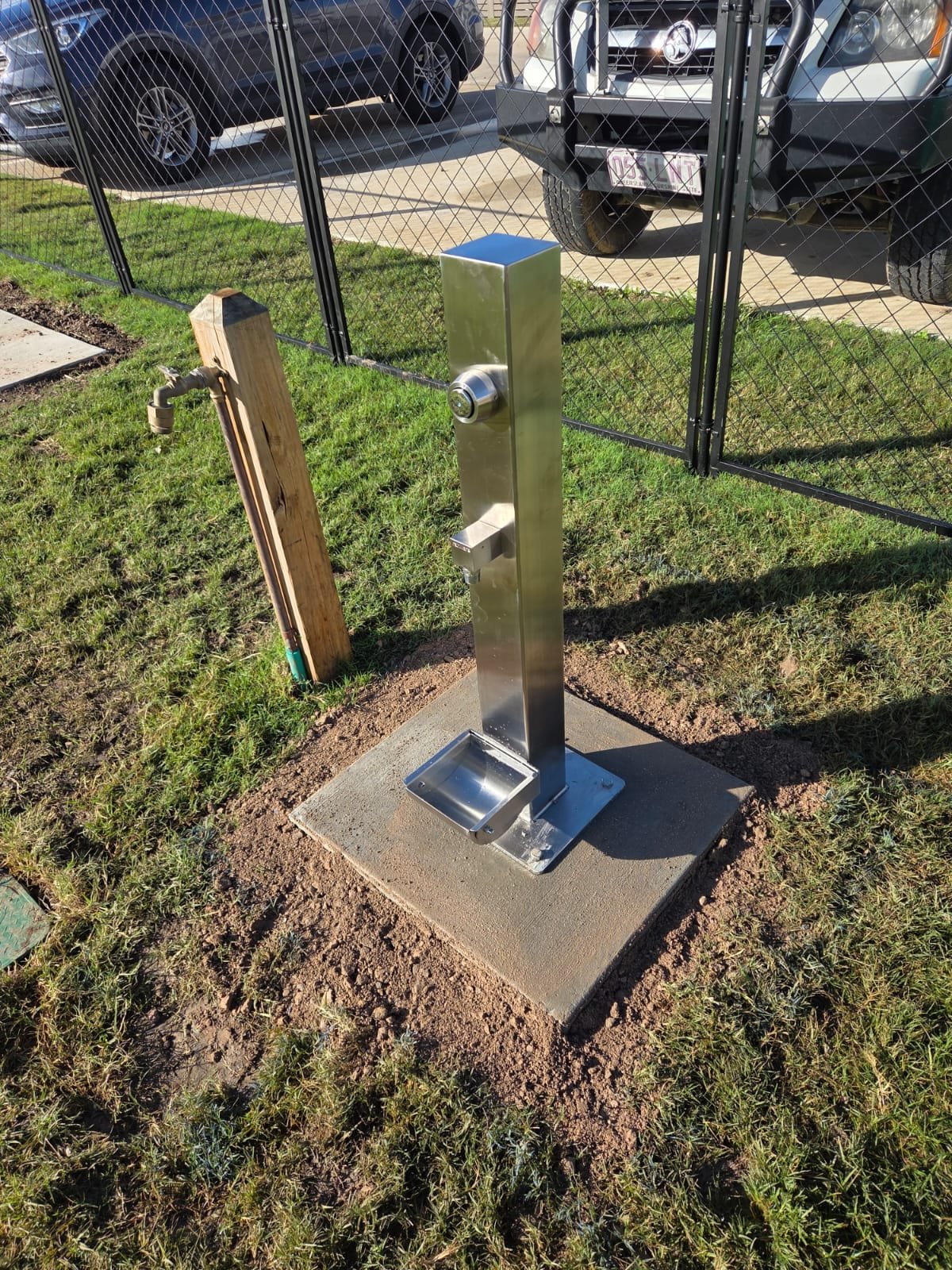 Stainless steel outdoor drinking station installed for a commercial facility in Hervey Bay