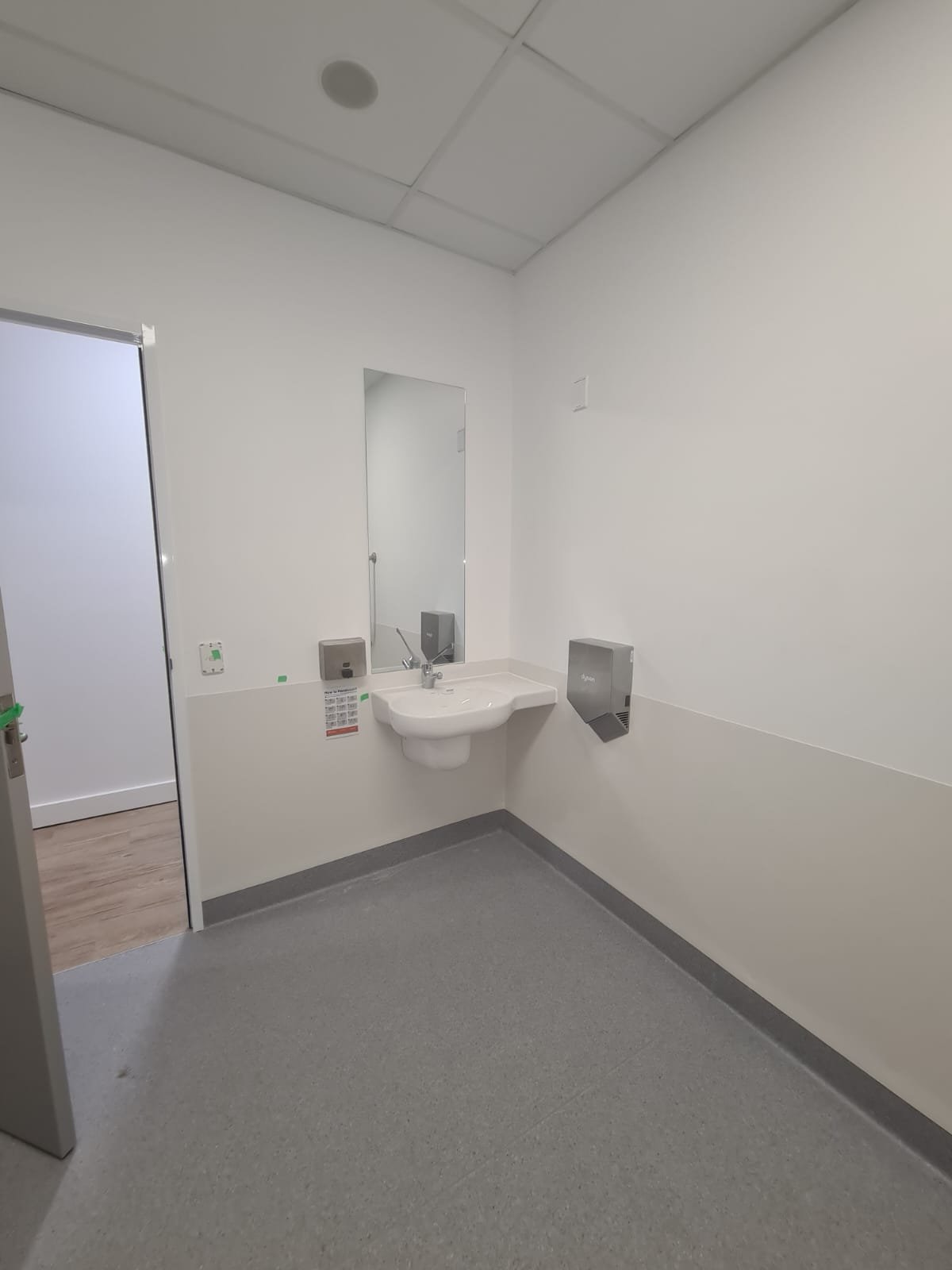 Accessible wash basin and hand drying facilities in a medical centre fit-out